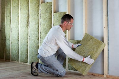 Mineral wool insulation fitted into a framed wall